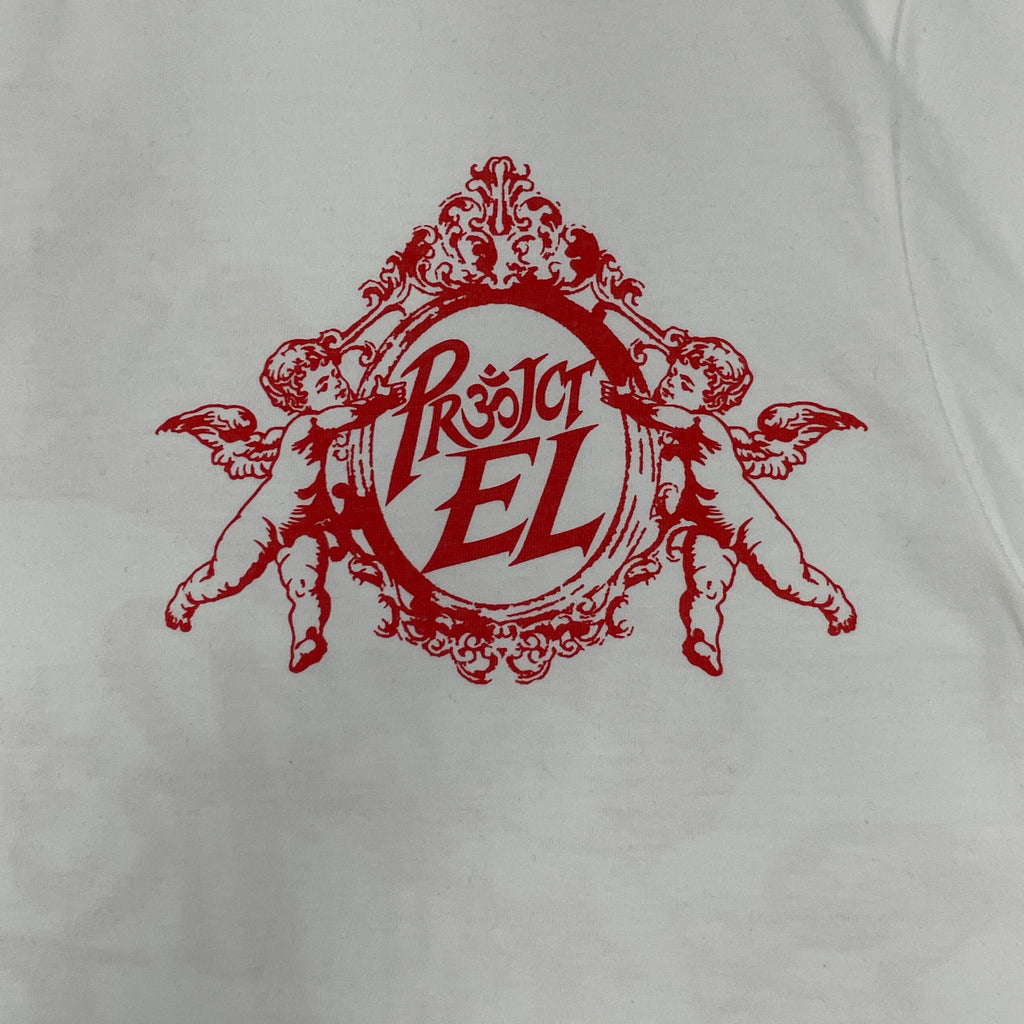 Close-up of red Project EL crest print on white T-shirt