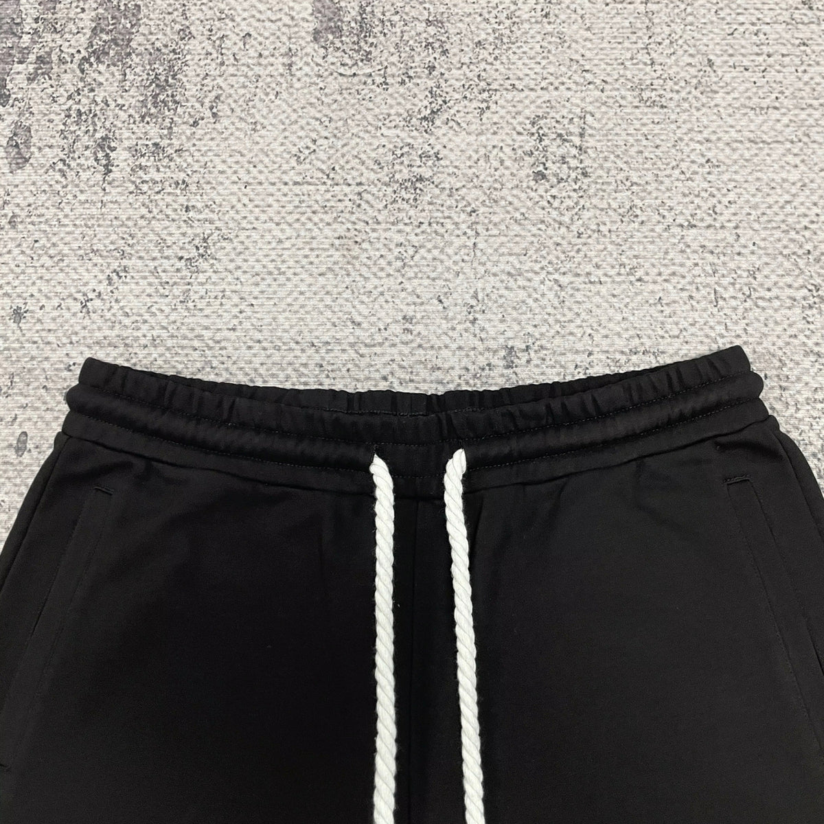 Elastic waistband and white drawstrings